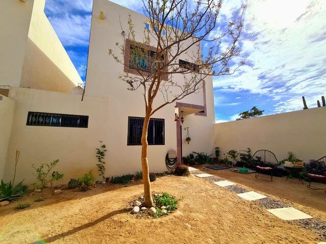 Los Cabos Csl N-E Of19:Genral GREAT INVESTMENT OPPORTUNITY - ENDLESS POSSIBILITIES!Discover the untapped potential of Casa Altezza, a spacious single-family home nestled in a sought-after residential community in northern Cabo San Lucas, conveniently located off Highway 19 and Tamaral Ave. What sets this property apart? THE LARGEST LOT! in its phase, offering unique development potential! Expand the current home, add residential rental-rooms, design a covered garage, or build the ultimate entertainment space with seamless access--this property's extra land is a blank canvas for creativity and investment. Completed in April 2022, Casa Altezza features 3 bedrooms and 2.5 bathrooms, including an ensuite bath in the master bedroom. The home boasts a spacious front patio with mature plants and trees, along with a private back patio with partial concrete flooring.Several thoughtful upgrades include: - Custom-designed kitchen with a modern, minimalist concept and an expanded window for ample natural light. - Enclosed bonus room for laundry and storage. - High 2.5-meter privacy walls surrounding the property. - Iron-protected doors and windows with installed screens. - Abundant water supply with a total of 23,700 liters, including two cisterns and a rooftop water tank. - New appliances, including a full-size washer & dryer, stove, hood, refrigerator, two inverter mini-splits, and ceiling fans.Casa Altezza sits in an ideal location, just 10 minutes from downtown Cabo San Lucas, Medano Beach, Puerto Paraiso Mall, and The Marina. Daily conveniences like supermarkets, shopping centers, medical facilities, and schools are just minutes away. Plus, the community is a gated neighborhood with electronic access, and a remarkably low HOA monthly fee of only – EXPANSIVE LOT, Cabo San Lucas, BS