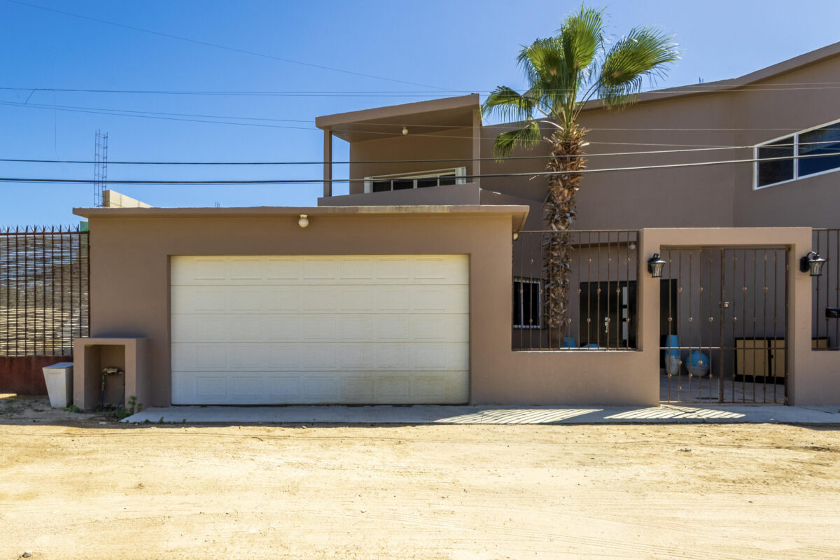 Los Cabos Gringo Hill Located in the original San José del Cabo surfing community of Gringo Hill, this fully gated and walled residence offers exceptional space, privacy, and flexibility for full-time living or a second home close to shopping, restaurants, and merely a 10-minute walk to the surf.''The Surf House'' is set on a generous 500 m² lot (approx. 5,382 sq ft). This two-story home features a substantial construction footprint and a layout designed for real-life living -- ideal for families needing storage for vehicles, surf gear, and all your Baja toys. The main level centers around an open-concept kitchen and dining area that connects seamlessly to the enclosed backyard, where local desert landscaping surrounds a large private pool. A TV room with an ensuite bath on this level provides flexibility as a ground-floor bedroom, guest suite, or workspace.Upstairs, three incredibly spacious bedrooms each include ensuite bathrooms, including a primary suite designed for privacy and comfort that also boasts its own outdoor space. A +500 square foot game room with a built-in bar and powder room adds additional living space ideal for entertaining, media, or family use.Two separate two-car garages flank the home -- a rare feature that offers extensive parking, storage, or future conversion potential.The home is offered unfurnished and presents an excellent opportunity for buyers to personalize finishes and modernize to their taste while benefiting from the impressive scale, structure, and unique layout already in place.With no HOA dues in Gringo Hill, coupled with a convenient central location, The Surf House stands out as a versatile home for buyers seeking size, privacy, and long-term opportunity. – The Surf House, San Jose del Cabo, BS
