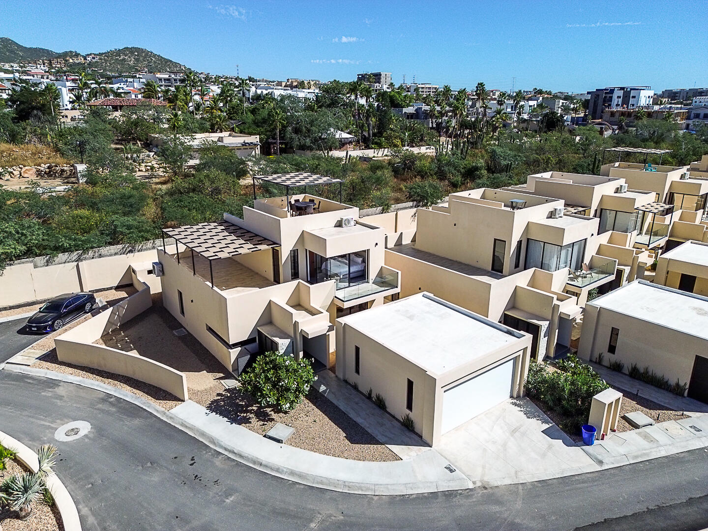 Los Cabos Cumbre Del Tezal Move-in ready and fully furnished. 2,045 sq ft of construction on a 2,551 sq ft lot with 3-car parking. Luxury finishes include marble flooring, wood kitchen with granite countertops, built-in wooden closets in all bedrooms, and vanities with tempered glass shower doors in all 3.5 baths. Fully equipped with 5 Gree inverter mini-split A/C units (3 Γ 1-ton, 2 Γ 2-ton), LG 22' French Door refrigerator, Whirlpool gas stove, and 1.7 cu ft microwave hood. Additional features: rooftop with bar, grill & sink, private terrace, storage, WiFi smart lock, private 5,000-liter cistern, and termite prevention system. ommunity: pool, gym, sports courts, kids' area, 3 clubhouses & 24/7 gated security for sale