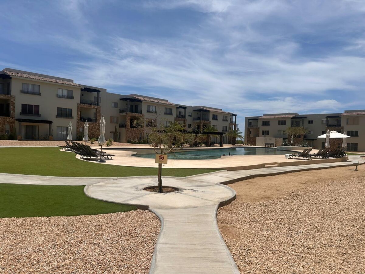 Los Cabos Camino Del Mar Ground-Floor Condo | La Joya at Camino del Mar, El TezalDiscover the perfect blend of comfort, convenience, and investment potential in this beautiful ground-floor condominium located in the highly sought-after La Joya Residences, within the master-planned community of Camino del Mar in El Tezal, one of Los Cabos' fastest-growing and highest-appreciating neighborhoods.This thoughtfully designed residence features:* 2 spaci ous bedrooms* 2 full bathrooms* TV / Family Room* Ground-floor location with direct access to the pool* Swimming pool right in front of your terraceResidents also enjoy exclusive resort-style amenities, including:✔️ Semi-Olympic swimming pool✔️ Fully equipped fitness center✔️ Kids' Park✔ – LADERA Carr. Transp. Km24.5 Cerro C, San Jose Corridor, BS